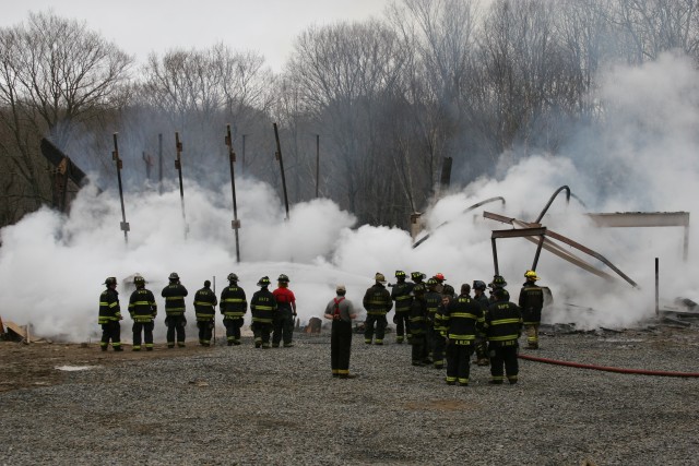 ONLY THINGS THAT REMAIN ARE SMOKE STEEL AND FIREMEN
PHOTO TAKEN BY JT. CAMP