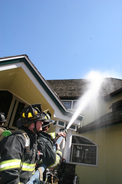 members soak the roof as a precaution
PHOTO TAKEN BY JT. CAMP 